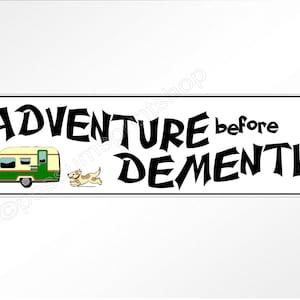 May include: A white sign with black text that reads "Adventure before Dementia". A cartoon camper, dog, and hot air balloon are pictured on the sign.