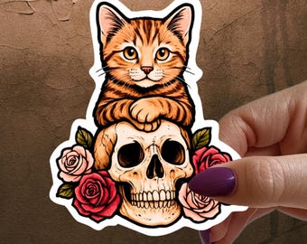 Cute but spooky cat sticker | Tabby kitten on skull vinyl decal | macabre aesthetic sticker for cat lovers