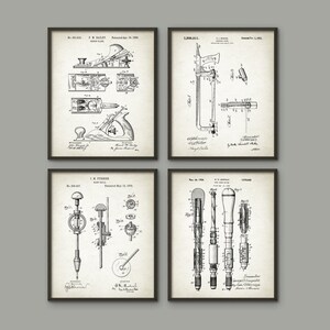May include: Set of four vintage black and white patent drawings for woodworking tools. The drawings show a plane, a saw, a drill, and a drill bit. Each drawing includes the patent number, inventor's name, and date.