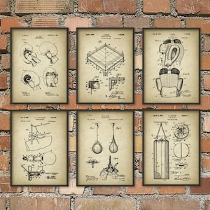 May include: Six framed vintage patent prints featuring boxing equipment. The prints include illustrations of boxing gloves, a ring, headgear, a speed bag, a double-end bag, and a heavy bag. The prints are in black and white on a tan background.