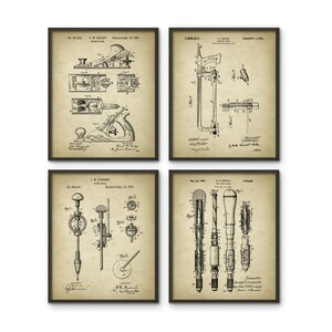 May include: Set of four vintage black and white patent drawings of woodworking tools. The drawings include a plane, a saw, a drill, and a gauge. Each drawing has the patent number, inventor's name, and date of patent.