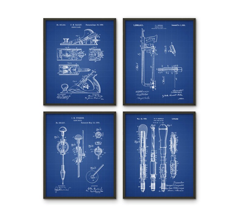 May include: Set of four vintage blueprint style prints featuring woodworking tools. The prints are framed in black and have a blue background. The prints feature a plane, a saw, a drill, and a screwdriver.