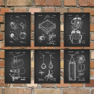 May include: Six framed black and white boxing-themed patent prints. The prints depict boxing gloves, a boxing ring, headgear, a speed bag, a double-end bag, and a heavy bag. The prints are displayed against a brick wall.