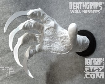 White Nightmare Glove DEATHGRIPS™ Colgador de pared para guitarras y otros artículos. Por el artista Gabe Escamilla