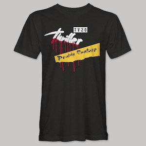 May include: Black t-shirt with a graphic design. The design includes the word "Thriller" in white with red dripping accents, the text "Double Feature" on a yellow banner, and the text "TV 20".