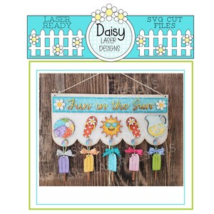 May include: Wooden sign with the text "Fun in the Sun" and decorative summer-themed cutouts. Includes a beach ball, flip-flops, a smiling sun, and a pitcher of lemonade. Below are popsicle-shaped ornaments in various colors.
