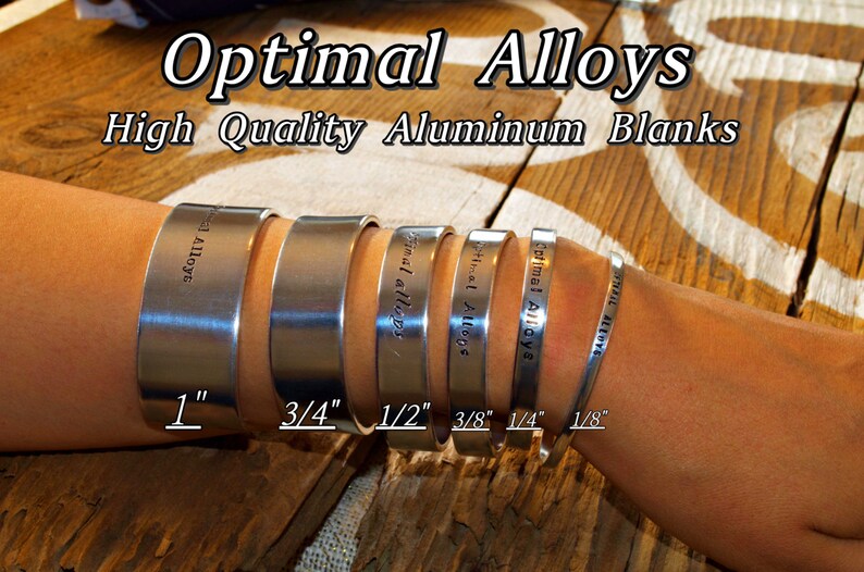 May include: A set of six silver aluminum blanks for crafting, ranging in size from 1 inch to 1/8 inch. The blanks are labeled with the text "Optimal Alloys" and the size in inches.