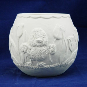 May include: White ceramic planter with a raised design of a chick and tulips. The planter is round and has a scalloped rim.