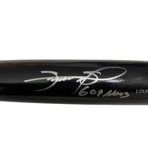 May include: A black Louisville Slugger baseball bat with a silver inscription that reads "PRO STOCK" and "LOUISVILLE SLUGGER". The bat is signed in silver by "J. Foxx" with the date "6.01.1993".