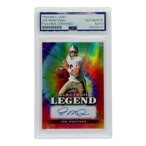 May include: A Joe Montana trading card, encased in a protective holder. The card features an image of Montana in his football uniform, with the number 16 visible. The card is labeled "Leaf Electrum Legend" and includes an autograph.