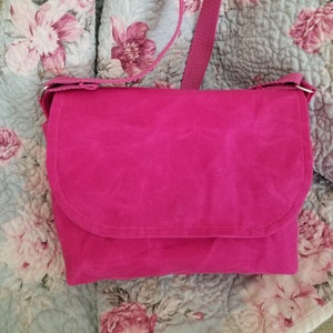 Waxed Canvas Handbag in a luscious Peony pink color, features a lime green zipper under magnetic flap, inside slotted pockets, pockets