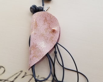 Heart shaped cord keeper