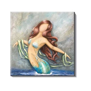 Ceramic coastal mermaid tile.