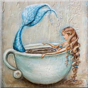 May include: A blue mermaid tail dips into a white teacup filled with brown liquid. A woman with long brown hair sits in the teacup, her head resting on her hand.