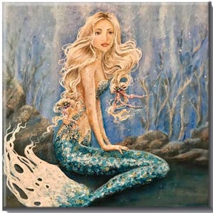 May include: A painting of a mermaid with long blonde hair and a blue and green tail. She is sitting on a rock in a blue and white underwater scene.