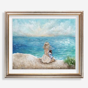 blonde mom brown hair daughter sitting on beach family love coastal wall art Bild 4