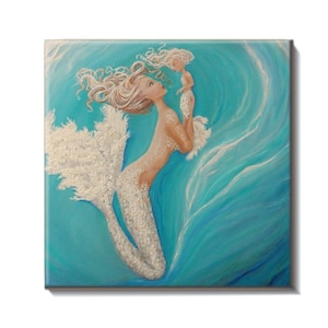 May include: A set of three ceramic mugs with a speckled, cream-colored glaze. Each mug features a different hand-painted floral design in shades of blue, green, and yellow. The mugs have a simple, rounded shape and a comfortable handle.