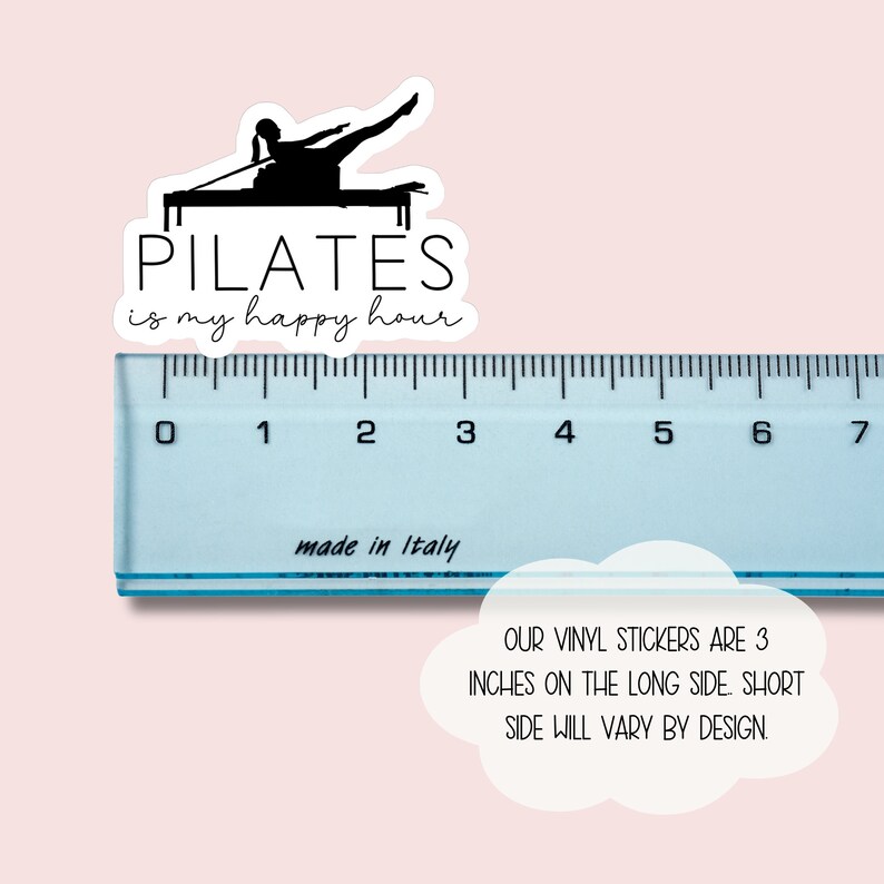 May include: A black and white sticker with a silhouette of a person doing pilates on a reformer. The text "PILATES is my happy hour" is written below the image. The sticker is 3 inches long.