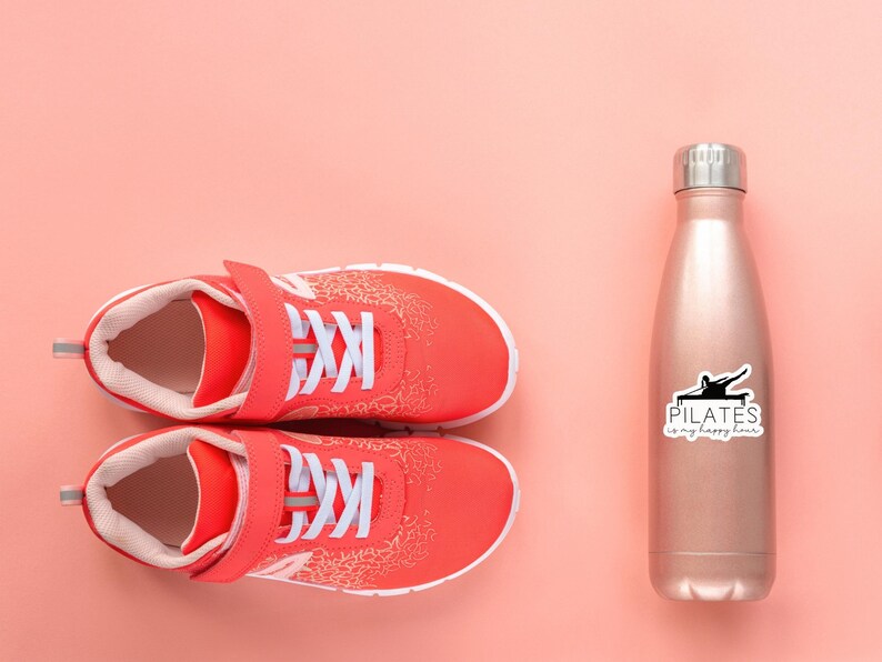 May include: A pair of red athletic shoes with white laces and a pink background. A rose gold water bottle with a black sticker that says "PILATES is my happy hour" is on the right side of the image.