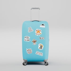 May include: A light blue suitcase with various stickers on it. The stickers include a sloth, a rainbow, a mushroom, and text that says "Pilates is my therapy", "Pose, Sweat, Hydrate", "Nerd", "Professional Baby Snuggler", and "Good Vibes Only".