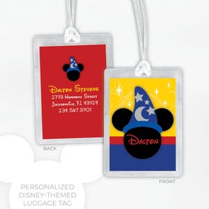 May include: Personalized Disney-themed luggage tag with a red back and a front featuring a yellow background with a blue hat, stars, and the name "Dalton". The back has the name, address, and phone number.