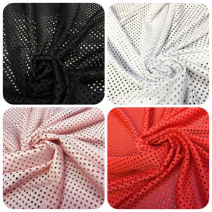 May include: Four fabric swatches in black, white, pink, and red. Each swatch has a square grid pattern with cut-out holes.