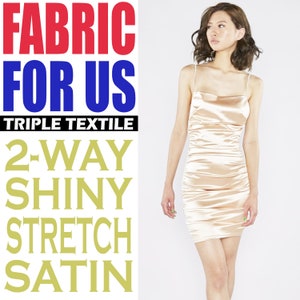 May include: A woman wearing a shiny, gold-colored, 2-way stretch satin dress. The dress has a cowl neck and spaghetti straps. The text "FABRIC FOR US TRIPLE TEXTILE 2-WAY SHINY STRETCH SATIN" is displayed on the left side of the image.