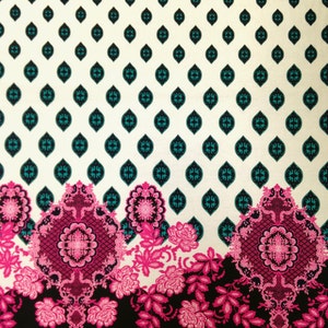 May include: White fabric with a repeating pattern of teal blue and black diamond shapes. The bottom of the fabric features a black background with a pink and white floral design.