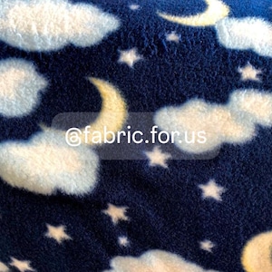 May include: Navy blue fleece fabric with a white cloud and yellow crescent moon pattern. The fabric also features white stars.