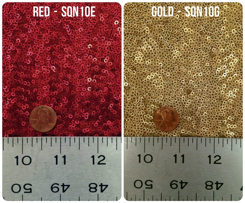 May include: Close-up of two fabric swatches with sequins. The swatches are red and gold. A penny is placed on each swatch for scale. A ruler is placed below the swatches with markings for inches and centimeters.