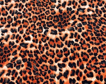 NUOVO splendido tessuto in velluto poli-spandex con stampa leopardata arancione morbido, larghezza 58"/60" BTY