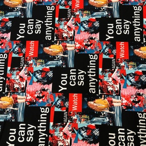 May include: Black fabric with a repeating pattern of a woman in a yellow shirt and red shorts standing in front of a city skyline. The text "You can say anything" is repeated in red and white lettering.