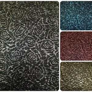 May include: A collage of four fabric swatches with a rose pattern. The swatches are in black, teal, burgundy, and olive green.
