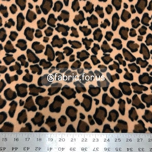 Creamy Wild Cheetah Animal Print Fleece Fabric