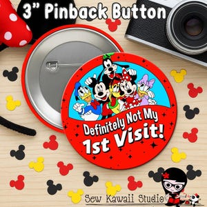 May include: A 3-inch round pinback button featuring a colorful illustration of Mickey Mouse, Minnie Mouse, Donald Duck, Goofy, and Daisy Duck. The text "Definitely Not My 1st Visit!" is printed in white on a red background below the characters.