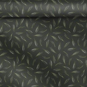 May include: Dark grey fabric featuring a repeating pattern of stylised, elongated leaf shapes in white and olive green. The leaves are scattered across the surface, creating a textured appearance. Suitable for craft projects.