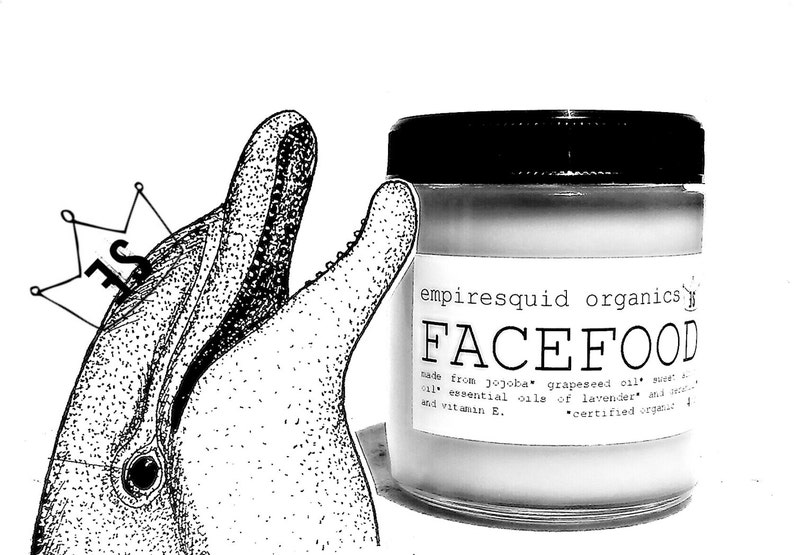 May include: Black and white image featuring a jar of "FACEFOOD" skincare product from "empiresquid organics." The jar has a black lid and a white label with product information. A dolphin illustration with a crown is on the left.