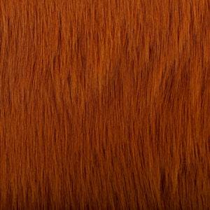 May include: Close-up of a rich, reddish-brown fur texture. The fur is soft and plush, with a subtle sheen.