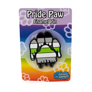 May include: A black enamel pin shaped like a paw print with the colours of the agender pride flag. The pin is on a colourful card with the text "Pride Paw Enamel Pin" and a logo for "Fursult Supplies".