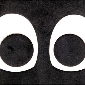 May include: Two white googly eyes with black pupils, isolated on a black background.