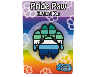 May include: A blue, green, and white enamel pin shaped like a paw print. The pin is on a card with the text "Pride Paw Enamel Pin" and a paw print logo that says "Fursult Supplies".