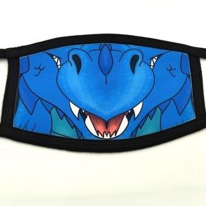 May include: A blue dragon face mask with black elastic ear loops. The dragon has a toothy grin and a blue and green background.
