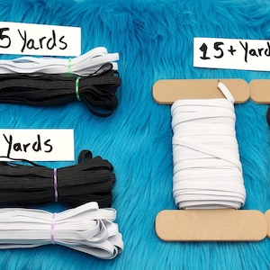 May include: White and black elastic cord spools in various lengths, including 5 yards, 10 yards, and 15+ yards. The spools are on a blue fuzzy surface.