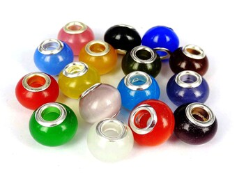 May include: Assortment of 16 colorful glass beads with silver accents. The beads are round and have a smooth, glossy finish. They are perfect for jewelry making or other craft projects.