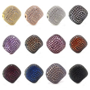 May include: Twelve square-shaped beads with a faceted design, each bead is covered in small rhinestones. The beads are in various colours including gold, silver, rose gold, purple, brown, black, red, blue, and grey.