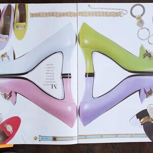 May include: A magazine spread showcasing women's footwear and accessories. The image features high-heeled shoes in white, pink, and green, alongside loafers in various colours. Accessories include a gold chain and a keychain.