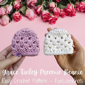 May include: Two crocheted preemie beanies, one lavender and one white, are displayed against a pink background with pink roses. The text "grace Tinley Preemie Beanie" and "Easy Crochet Pattern - EyeLoveKnots" is visible.