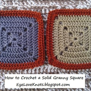 May include: Two crocheted granny squares, one in a light gray color and the other in a beige color. Both squares have a dark orange border. The text "How to Crochet a Solid Granny Square" and "EyeLoveKnots.blogspot.com" is below the squares.