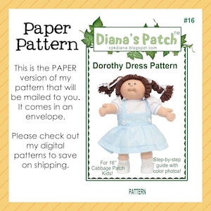 May include: A paper pattern for a Dorothy dress, designed for 16-inch Cabbage Patch Kids dolls. The image features a doll wearing a blue gingham dress with white accents. The pattern includes a step-by-step guide with color photos.