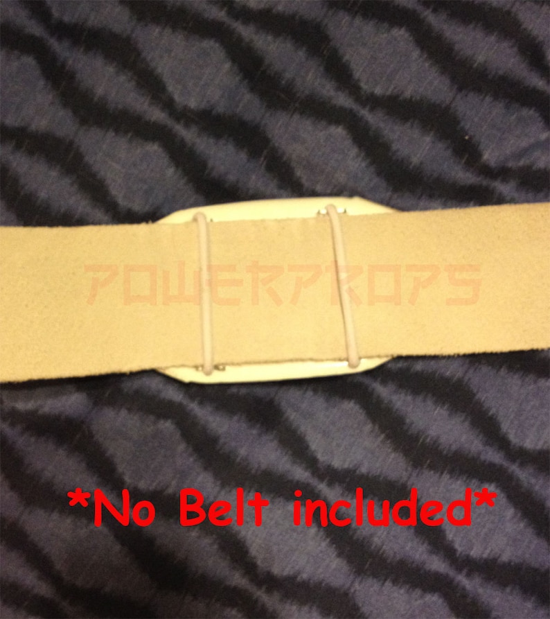 May include: A close-up of a beige belt with a white plastic piece and two beige elastic bands. The text "POWER PROPS" is visible on the belt. The text "*No Belt included*" is written in red.